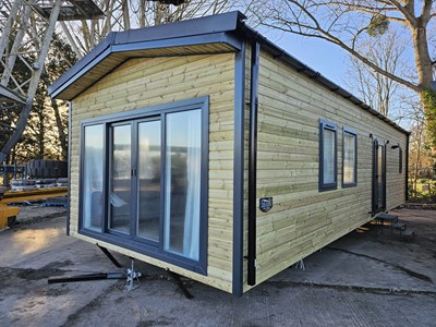 Lot 299 - Unused The Steel Holiday Homes Ltd 36' x 13' (Steel Structure) 2 Bedroom Timber Clad Lodge, Shower Room, Central Heating (Fully Furnished - Sofas, Beds, Fire, Dining Table, Microwave, Fridge Freezer)